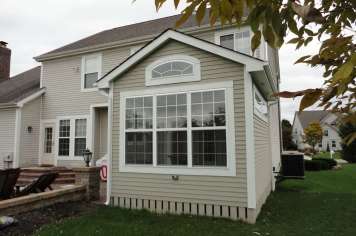 Custom sunroom construction Columbus Ohio white exterior windows
