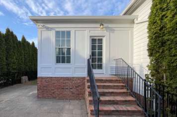 Modern sunroom interior Columbus Ohio black framed windows natural light