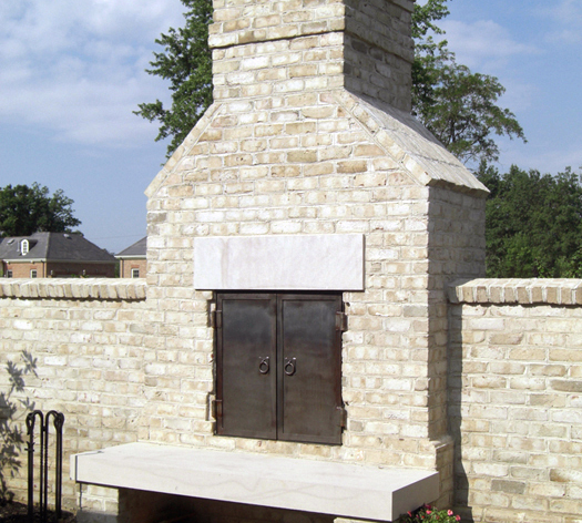 Suncraft Design Build custom stone outdoor fireplace with patio and outdoor furniture Columbus Ohio