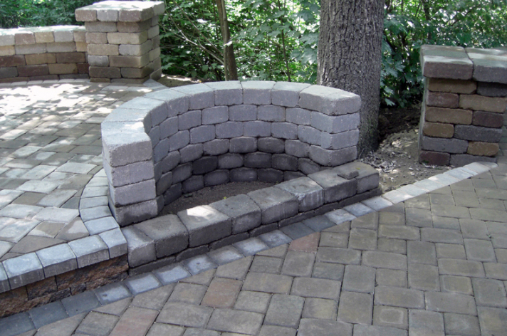 Suncraft Design Build custom fire pit with stone seating wall residential backyard Columbus Ohio