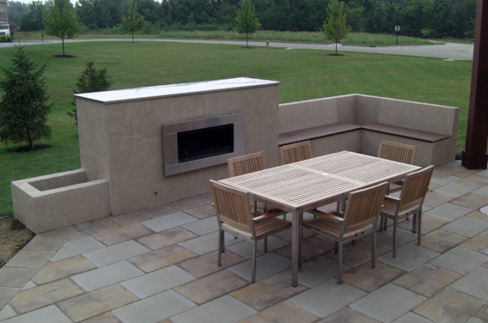 Suncraft Design Build custom stone outdoor fireplace with patio and outdoor furniture Columbus Ohio