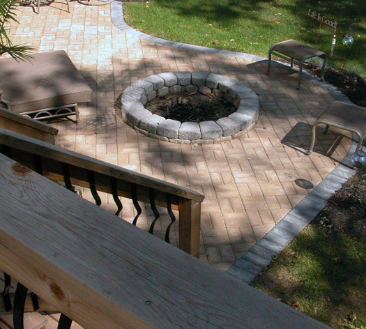 Suncraft Design Build custom fire pit with stone seating wall residential backyard Columbus Ohio