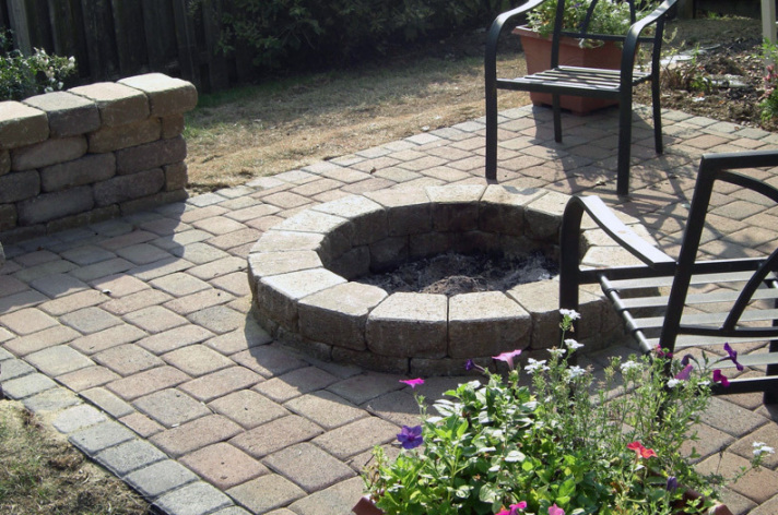 Suncraft Design Build custom circular fire pit with stone surround paver patio Columbus Ohio