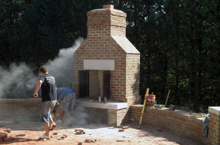 Suncraft Design Build custom built-in outdoor fireplace with stone patio Columbus Ohio