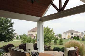 Suncraft Design Build custom open porch with dark wood gabled roof and open beam design Columbus Ohio