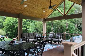 Suncraft Design Build custom open porch with wood ceiling ceiling fan and outdoor dining Columbus Ohio