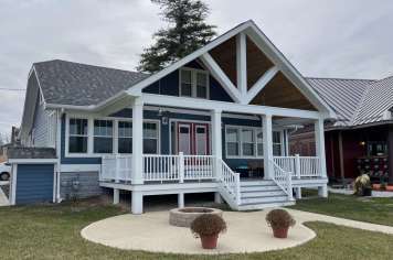 Suncraft Design Build custom open porch with craftsman style columns and circular patio Columbus Ohio