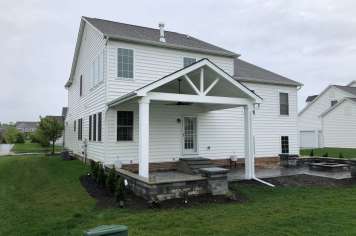 Suncraft Design Build custom open porch with white gabled roof attached residential home Columbus Ohio