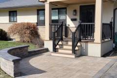 Suncraft Design Build custom paver patio with white home and landscaping Columbus Ohio