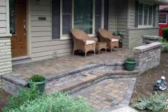 Suncraft Design Build custom paver patio with stone steps and wicker seating front entry Columbus Ohio