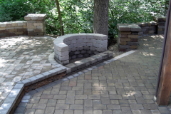Suncraft Design Build custom paver patio with curved stone seating wall and landscaping Columbus Ohio