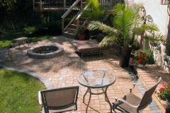 Suncraft Design Build custom paver patio with fire pit seating area and tropical landscaping Columbus Ohio