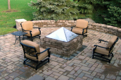 Suncraft Design Build custom paver patio with wicker seating and stone wall Columbus Ohio