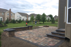 Suncraft Design Build custom paver patio with stone seating wall residential backyard Columbus Ohio