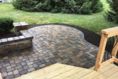 Suncraft Design Build custom paver patio with curved stone steps and deck transition Columbus Ohio