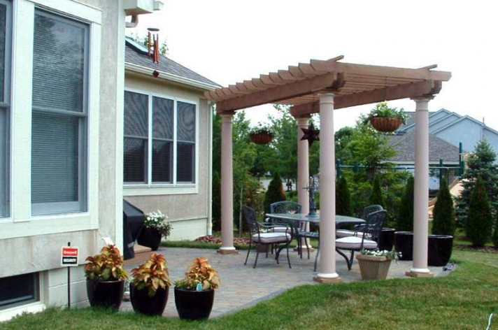 Suncraft Design Build custom pergola attached to modern home with paver patio Columbus Ohio