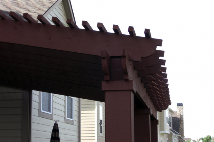 Suncraft Design Build custom dark wood pergola over patio with outdoor seating Columbus Ohio