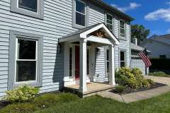 Suncraft Design Build custom front porch with white columns two-story gray residential home Columbus Ohio