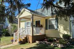 Suncraft Design Build custom front porch addition with columns and railings residential home Columbus Ohio