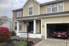 Suncraft Design Build custom front porch with white columns large two-story residential home Columbus Ohio