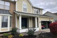 Suncraft Design Build custom front porch addition with columns and landscaping two-story home Columbus Ohio