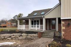 Suncraft Design Build custom front porch with white columns attached residential home Columbus Ohio