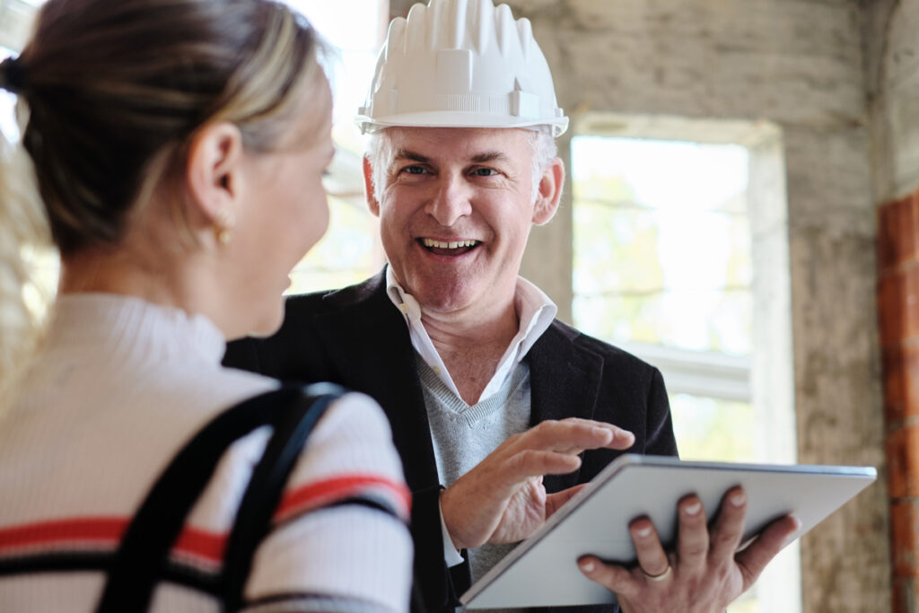 Woman customer talking to construction planner